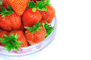 A heap of  strawberries in glass bowl. Isolated