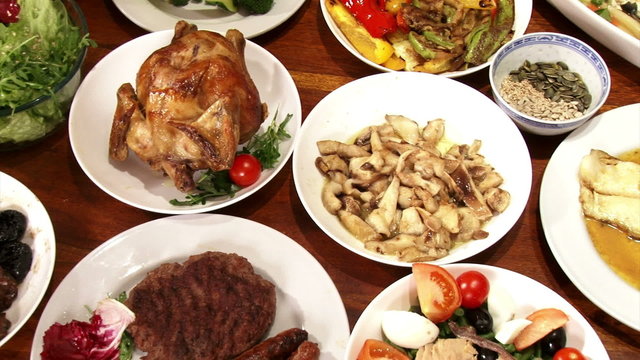 Festive foods, served on table, pan left
