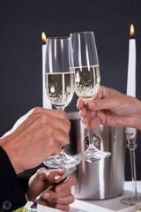 Romantic couple toasting each other