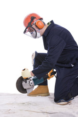 workman with angle grinder
