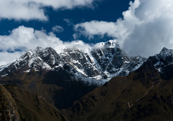 Snowbound mountain peaks and clouds in Himalayas