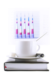 Coffee cup, standing on the organizer. Isolated