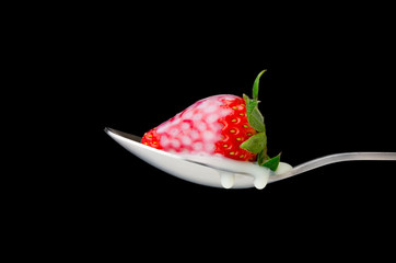 Pouring Condensed Milk on Strawberry
