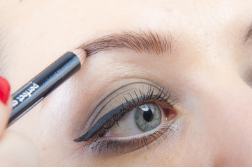 Naklejka premium Girl making up