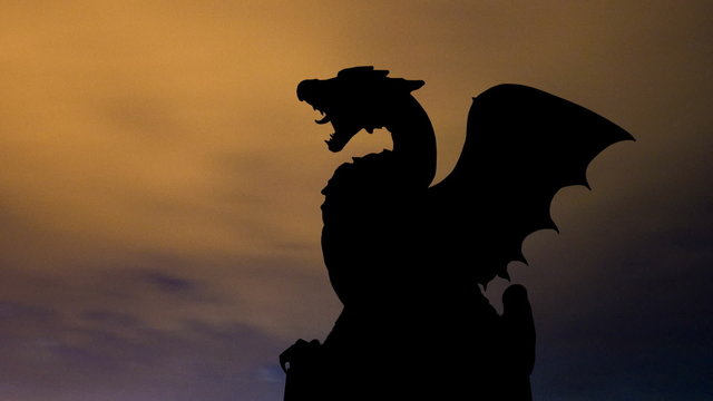 Slovenia Dragon bridge and monument night clouds