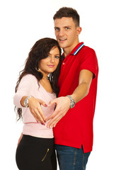 Couple making heart shape with hands