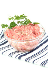 Bowl of raw ground meat isolated on white