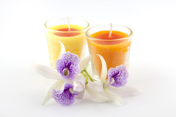 Fototapeta na wymiar candles and orchid flower on white background