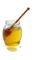 Honey with wood stick , isolated on white background