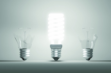 Idea and mistake or failure: illuminated bulb among two broken o