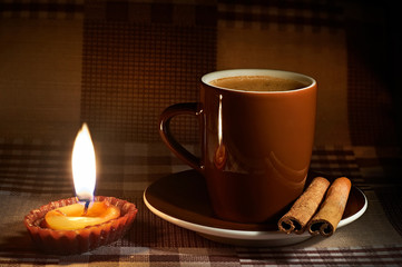Cup of coffee in natural candle lighting