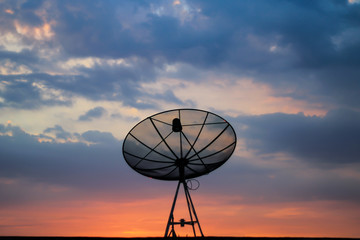 Telecommunication Satellite dish background sky sunset