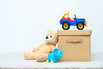 toys and brown textile box with handles