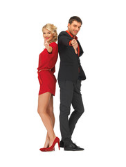 man and woman showing thumbs up, down