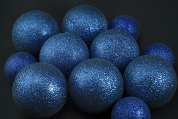 Blue Christmas balls on black