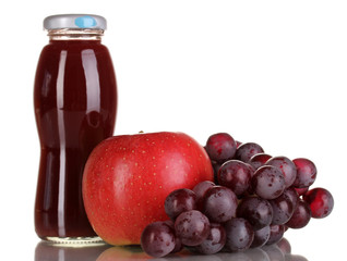 Delicious grapes and apple juice in glass bottle and pink
