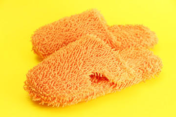 bright slippers, on yellow background