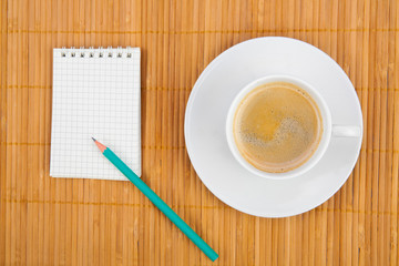 blank notebook coffee cup on wooden background