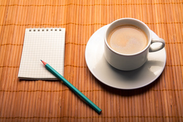 blank notebook coffee cup on wooden background