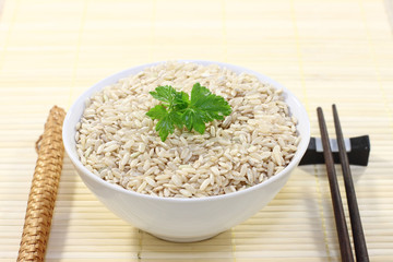 Bowl of rice and chopsticks