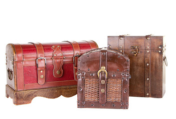 group of three chests or trunks isolated
