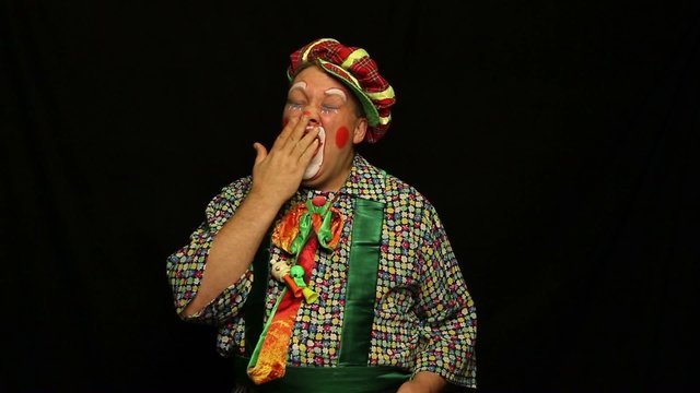 Clown with a movie clapperboard