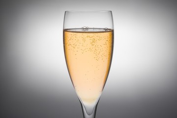 flute of champagne with gold bubbles