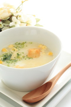 Corn potage soup with toast and herb on top