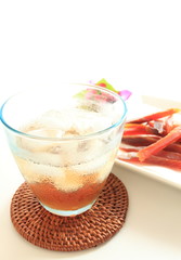 plum liquor on rock with dried salmon