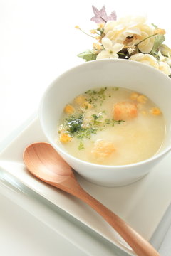 Corn potage with toast and herb on top