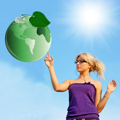 Ecology concept. Green planet and young woman