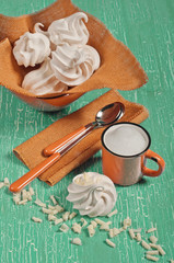 Top view of meringues and orange cup