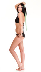 brunette girl bikini measuring waistline tape