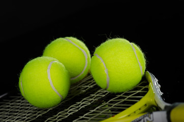 Tennis balls and racket