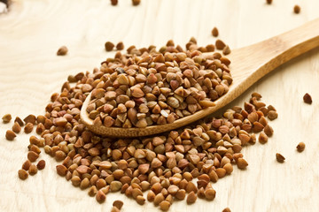 Dry buckwheat  in wooden table
