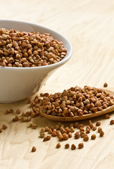 Dry buckwheat  in ceramic bowl