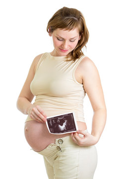 Pregnant woman with ultrasonic baby shot isolated on white