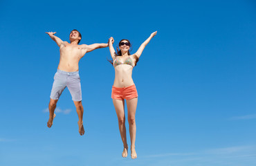 Happy Young Couple Together On The Beach