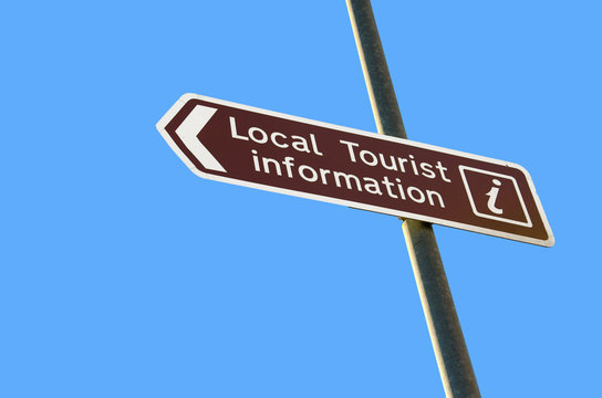 tourist information sign on blue sky