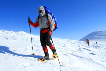 Winter hiking in snowshoes.