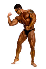 Attractive male body builder, demonstrating contest pose