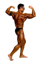 Attractive male body builder, demonstrating contest pose