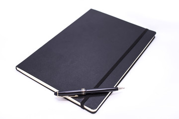 Open notebook with a pen - obrazy, fototapety, plakaty