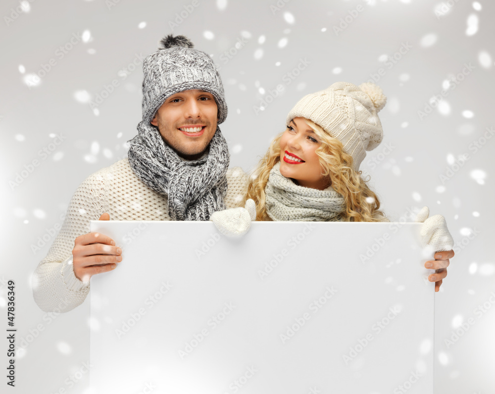 Canvas Prints couple in a winter clothes holding blank board