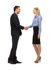 man and woman shaking their hands
