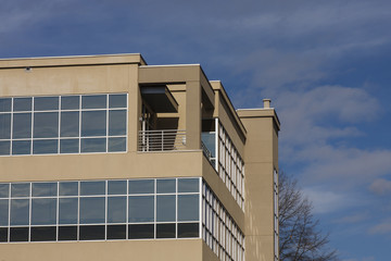 Fototapeta na wymiar Modern Stucco Building with Chrome Trim