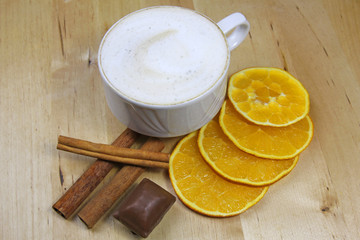 cup of coffee, cinnamon, orange and chocolate