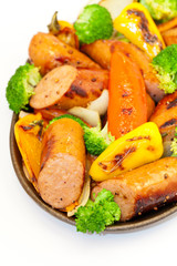 Grilled sausages and vegetables