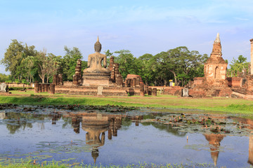 Fototapeta na wymiar Buddha Statue at Temple in Sukhothai Historical park , Thailand