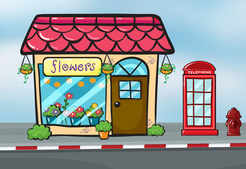 Obraz premium A flower shop and a callbox